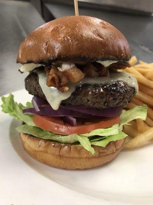 Burger with cheddar cheese, lettuce, tomato, onion, bacon and truffle aioli