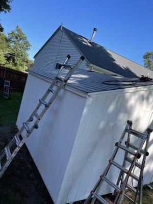 Shed power wash, paint and new roof.