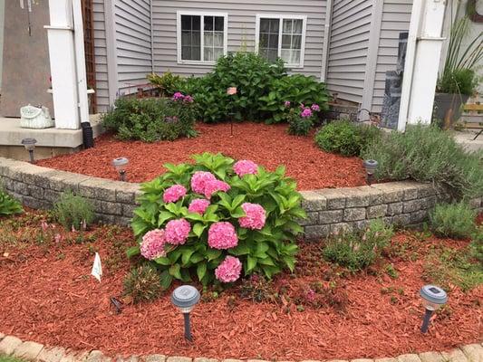 Fresh mulch brightens up any flower bed and improves curb appeal.