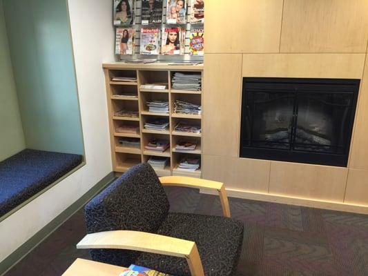 Fireplace in a very comfortable hotel-style lounge, offering a wide-selection of up-to-date periodicals.