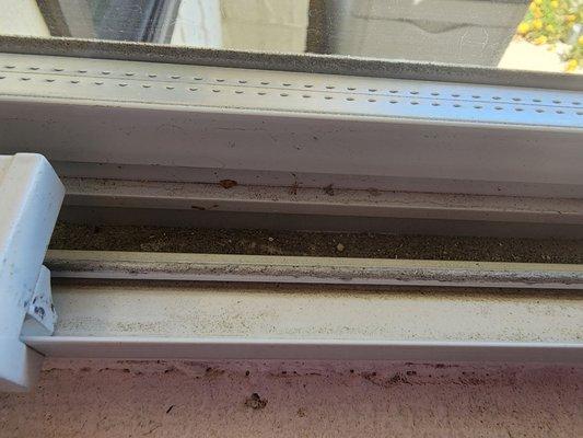 The filthy sill and track Fish Window Cleaninh in Palm Desert CA left behind.