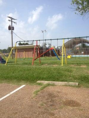 Swing set, slide, basketball court, empty pool. Where all the peeps?