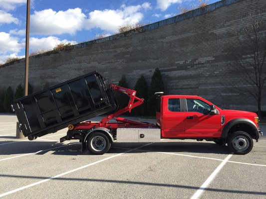 Stellar 84-10Flex with 10 yard Container mounted on Ford F-550 Truck