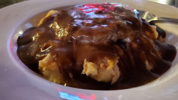 Beef burger with cheesy mashed and beef gravy smothered on top just the way I like it