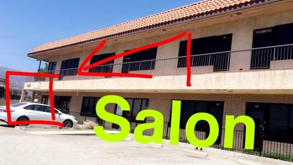 The salon exact location - located on the two story building on the back of the structure...