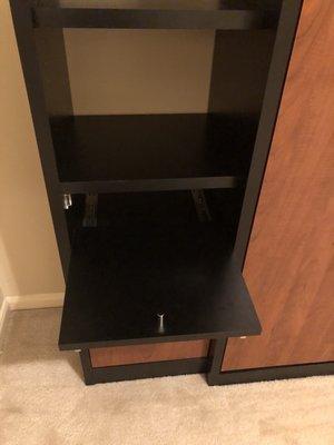 Built in nightstand. A little table slides out. It's laminated so you can put a drink there.