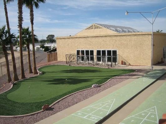 Shuffleboard & Putting Green with Pool Building in Background