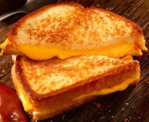 Classic Grilled Cheese
Aged Cheddar & American Cheeses on Country White Bread served w/ a dipper of Cream of Tomato Soup