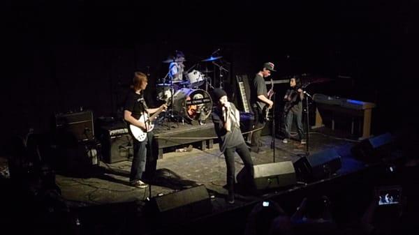 Eric's students rocking out on stage for "Rock It Music Academy's" final rock camp concert.