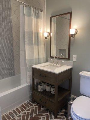 Expanded powder room to include bath/shower