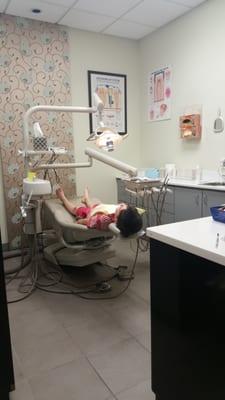 My seven year old is so comfortable at the dentist he takes his shoes off!