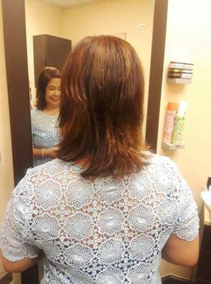 Shag haircut with Carmel and Rose Gold Highlights.