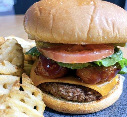 Plant-based patty seasoned to perfection topped with vegan cheese, 2 beyond chkn tenders drizzled in BBQ sauce and the fixings