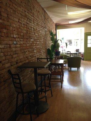 The exposed brick wall is original to the building, built in 1832.