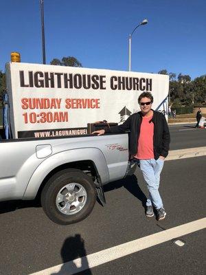 Pastor Scott with our sign getting ready for the Christmas parade!