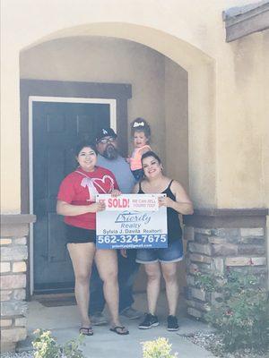 Excited clients who purchased their dream home through Priority Realty.