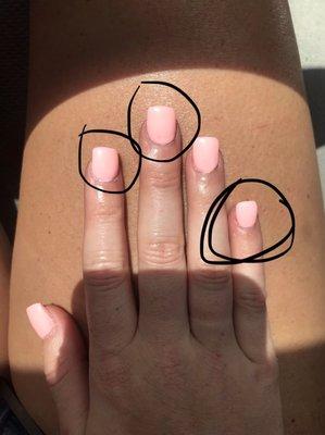 Pinky Nail looks lumpy and fat. Other two nails are visibly crooked & at the base you can see where the nails didn't get enough polish.