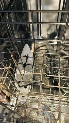 Zip ties in dishwasher rack.