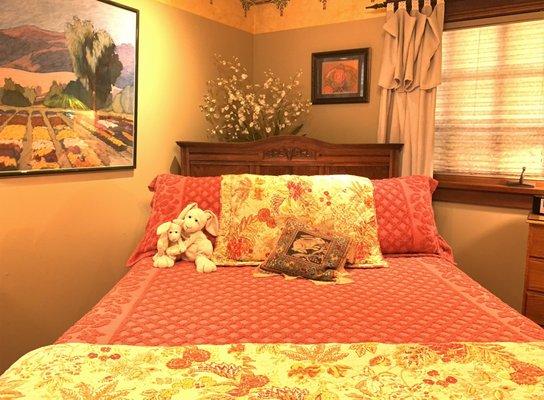 Arcata Stay's Rose Court Cottage main room sumptuous queen bed with memory foam mattress topper.