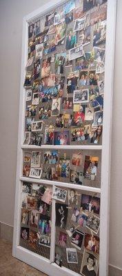 Wooden screen door with chicken wire to hold 100 photos!