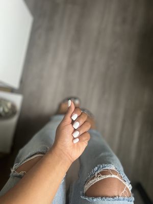 Simple white gel nail and pedi . Nice place .