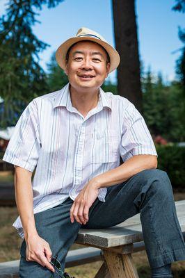 a scientist poses with their leg up at a vineyard in Portland Oregon