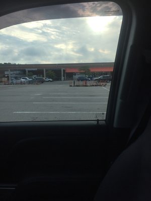 Dunkin Donuts is under the orange overhang, connected to The Home Depot