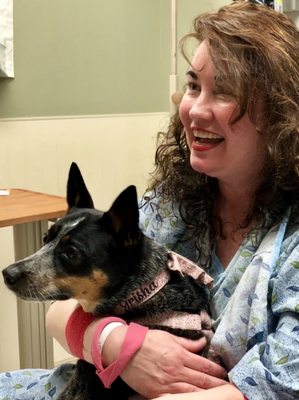 Happy Martha's Vineyard Hospital Patient with visit from Grisha the dog.