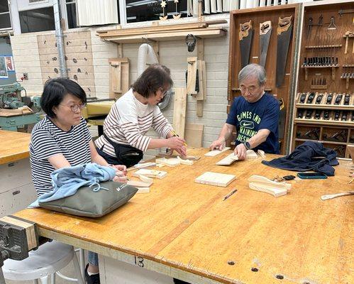 Adult Students working on a project in our Woodworking class.