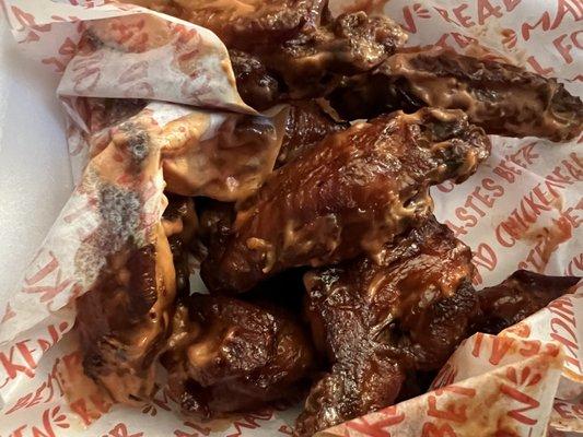 Bone in wings with mad hot sauce.