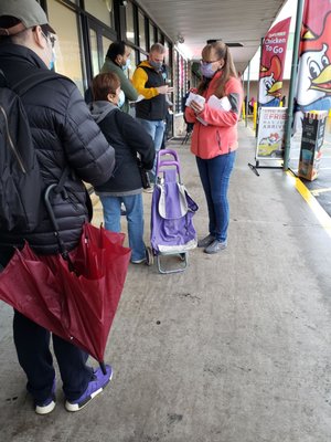 Lady handing out tickets