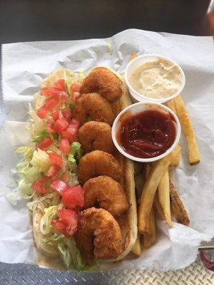 Shrimp Po Boy, fresh hand breaded shrimp on a toasted potato roll.