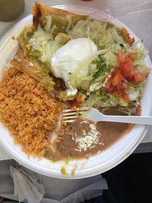 Tamales were topped with gooey cheese.