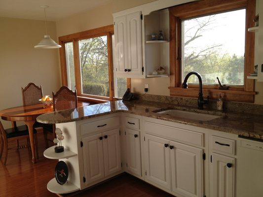 Briarcliff Kitchen Remodel: Updated picture windows, cabinetry, granite countertops, Bella Cera hardwood flooring and new molding.