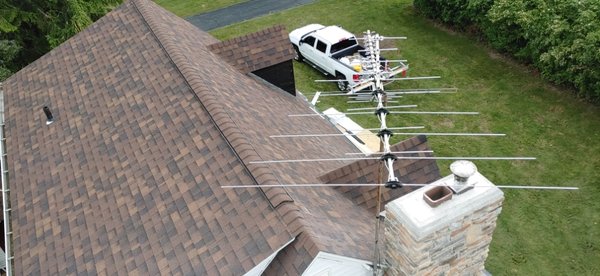 Nice straight roof lines from this view. New chimney stone and custom cap. #fearnoheights!