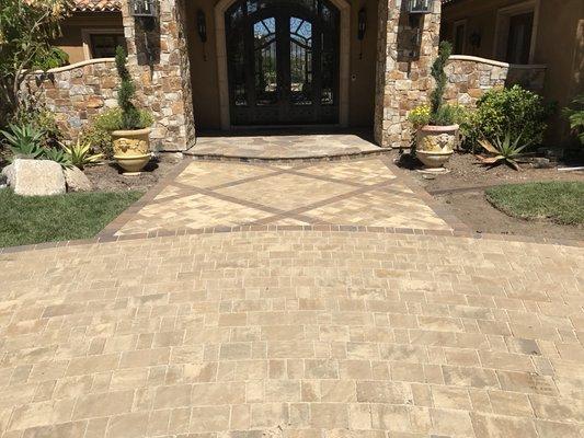 We helped the homeowner design something to enhance his welcome mat. Pavers can be laid in such a way to invite guests in.