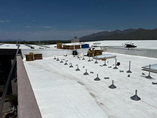 Install racketing process  going up on flat butterfly roof