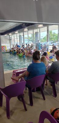 about 5 classes being held simultaneously on this side of the pool alone; bench area on sides is VERY crowded