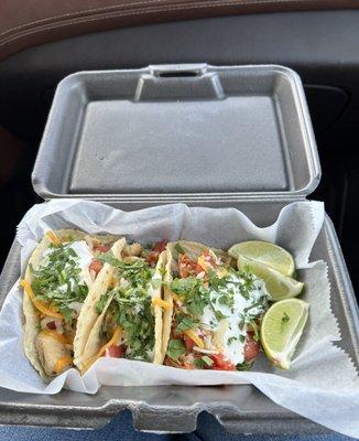 Chicken Tacos on Homemade Corn Tortillas. Love the fresh cilantro & limes that come with it. Highly recommend the spicy shredded chicken