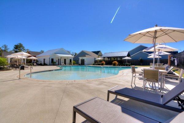 Neighbors enjoy the expansive sun deck and salt water pool