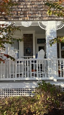 There are lots of tables on the porch.  And small ones in the dining room. No need to sit at a long shared table here.