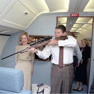 This is a PRESIDENT.  You don't get much cooler that Ronald Reagan scoping out his new rifle on Air Force One.