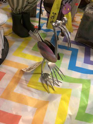 A cute little flamingo made out of silverware