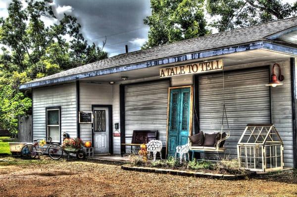 Our studio. A 1300sqft garage turned studio. The exterior keeps that old garage feel. Many photographers use the props out front