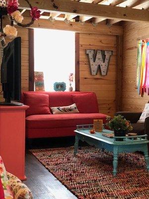 One of two living areas in this cozy 1 story open concept log cabin.