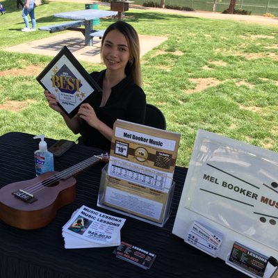 Meghan out in the community, talking with parents, kids about music!