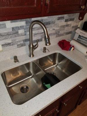 New countertop, sink, faucet and Alaskan gray stone tile for the backsplash.