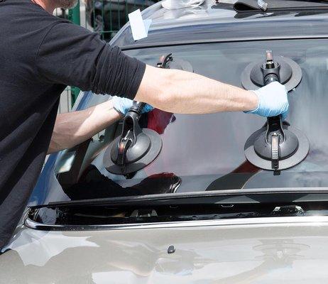 Placing glass onto vehicle for final steps of installations