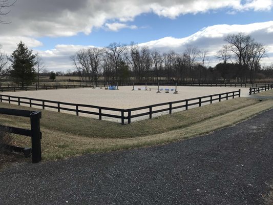 Riding ring with EquiFibre footing and jumps