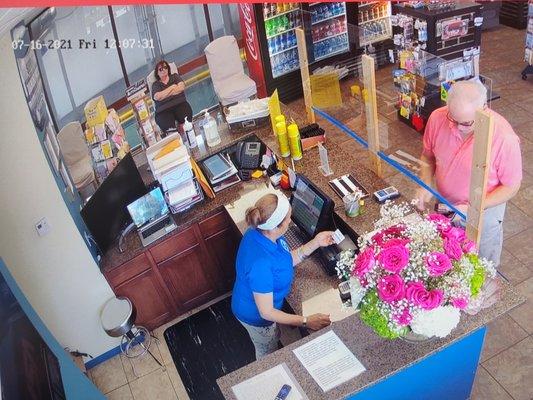 Cashier receiving Mr Rowley's card